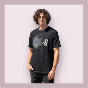 Make A Smile by R. Gegen Noviara Black Graphic Tee